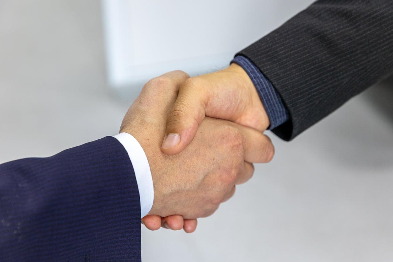A professional handshake in a business meeting